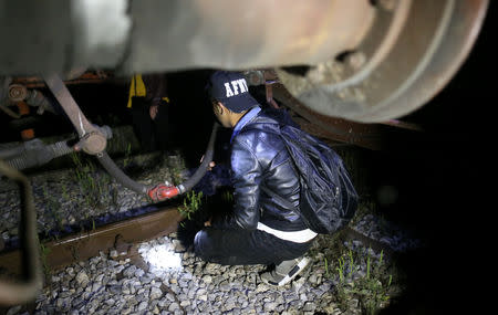 A migrant is stopped by the border police while trying to enter Bosnia from Serbia though the border near Zvornik, Bosnia and Herzegovina September 1, 2018. REUTERS/Dado Ruvic