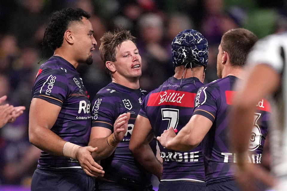 Harry Grant celebrates with his teammates.