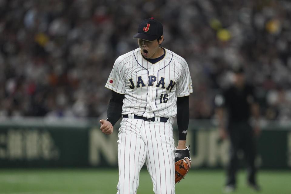 Shohei Ohtani gestures during a World Baseball Classic quarterfinal game between Italy and Japan last year.