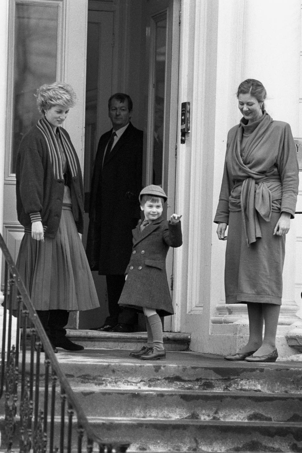 Prince William appeared fairly happy on his first day at big school, wearing the his double breasted school coat and a grey cap. His mother, the late Princess of Wales, dropped him off. <em>[Photo: PA]</em>