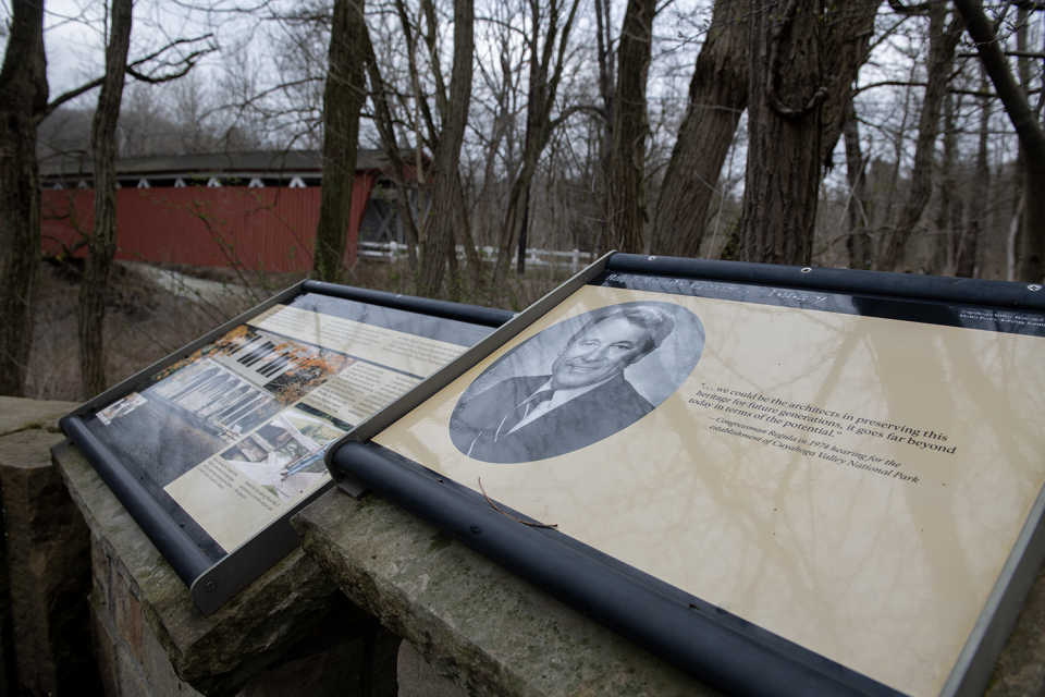 A marker recognizing former congressman Ralph Regula is displayed near the Everett Covered Bridge in the Cuyahoga Valley National Park. The marker is on land owned by Metro Parks, serving Summit County
