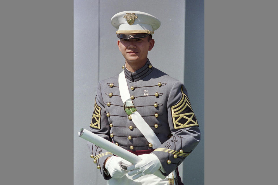 FILE - Hun Manet, the first Cambodian to graduate from the United States Military Academy, holds his diploma on May 29, 1999, after he received it from the military academy at West Point, N.Y. Cambodia's Hun Sen says he is ready to hand the premiership to his oldest son, Hun Manet, who heads the country’s army. (AP Photo/Ken Bizzigotti, File)