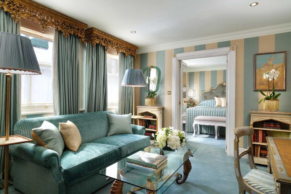 Inside a suite decorated in cream and blue at The Milestone hotel in London