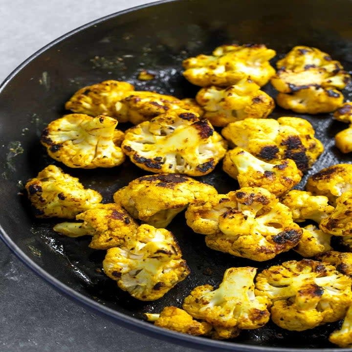 Crispy roast cauliflower in a skillet