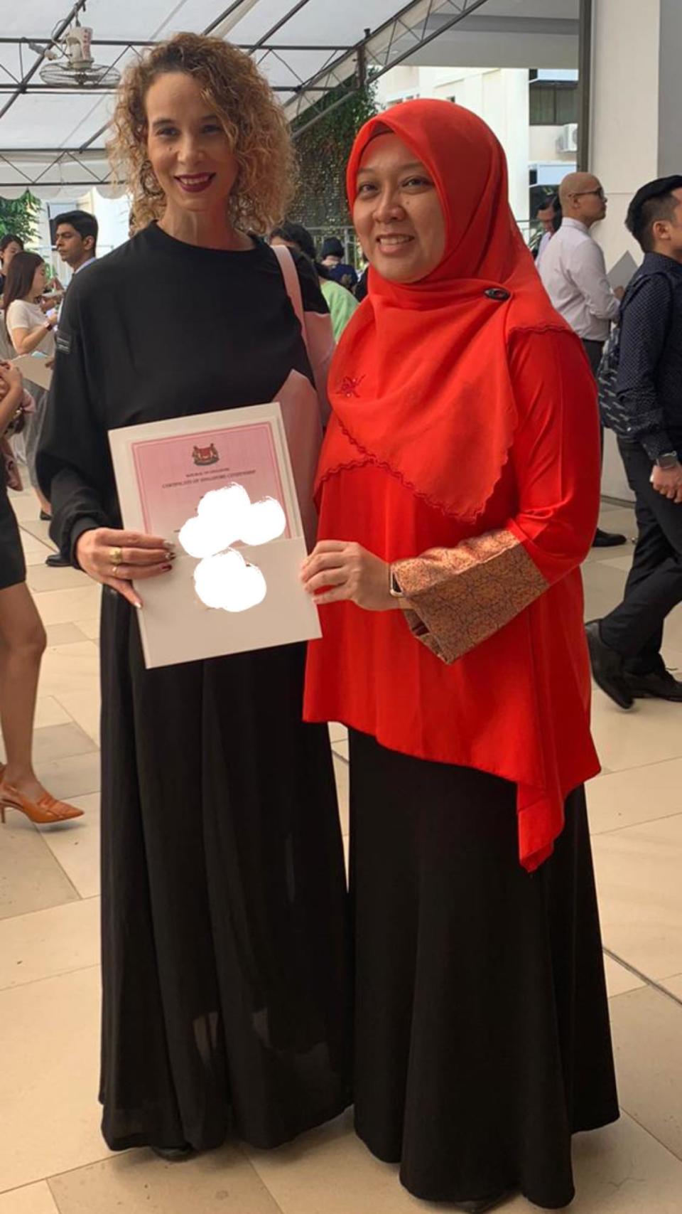 Wendy Jacobs, formerly South African wife of Singaporean football star Fandi Ahmad, received her certificate of citizenship from MP Intan Azura Mokhtar on 12 January 2020. (PHOTO: Intan Mokhtar/Facebook)