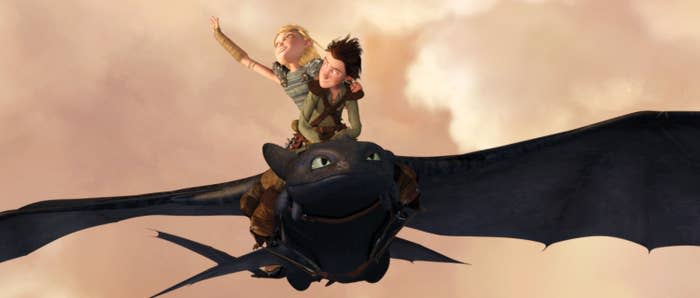 Two people flying on a dragon