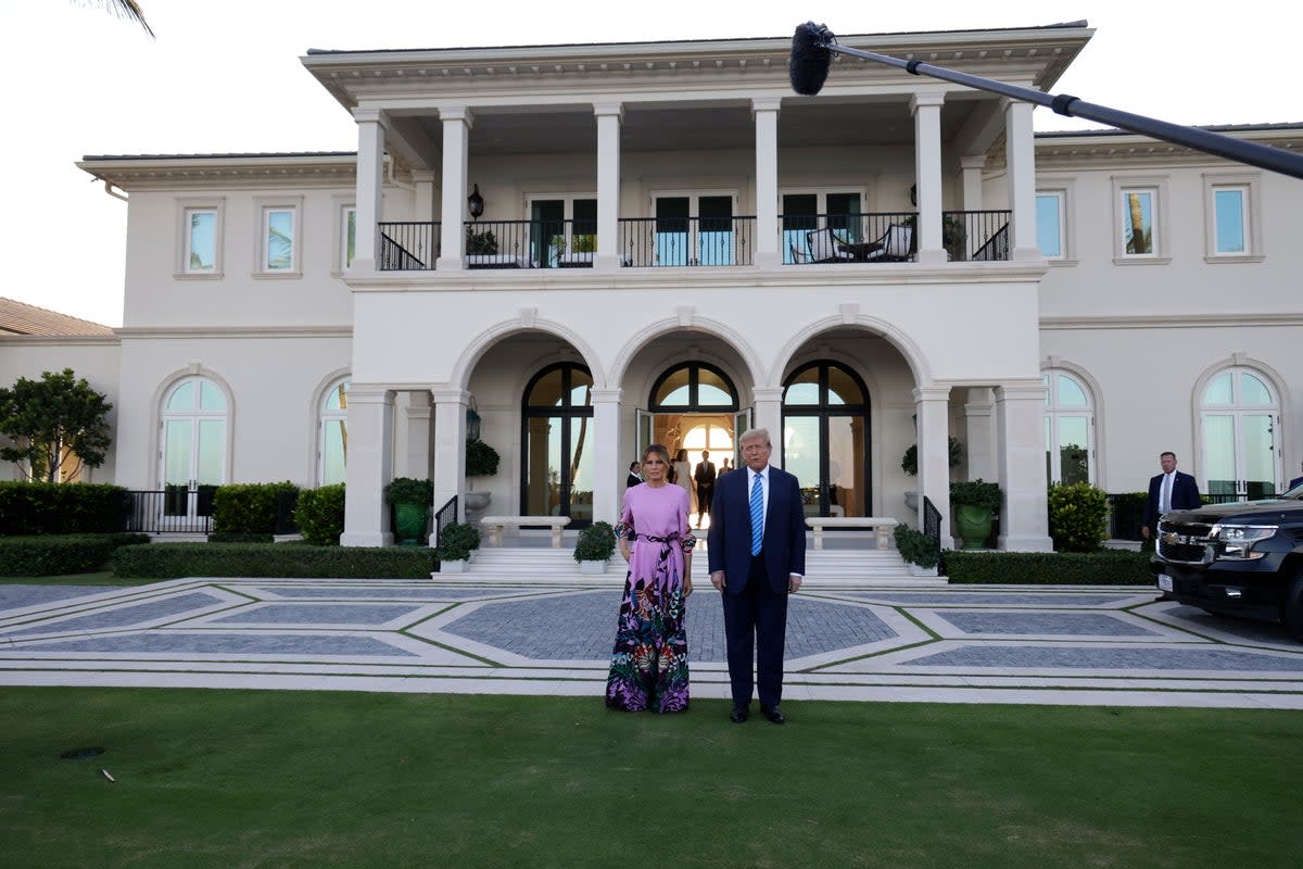 Donald and Melania Trump pictured on Saturday at the home of hedgefund manager John Paulson in Palm Beach during a fundraiser (Getty Images)