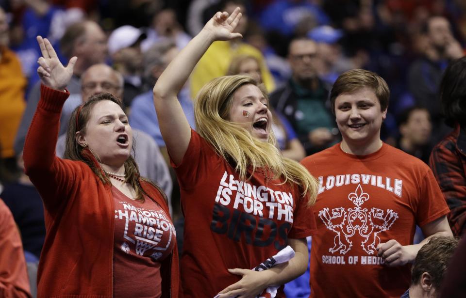 Louisville fans cheer before an NCAA Midwest Regional semifinal college basketball tournament game against the Kentucky Friday, March 28, 2014, in Indianapolis. (AP Photo/David J. Phillip)
