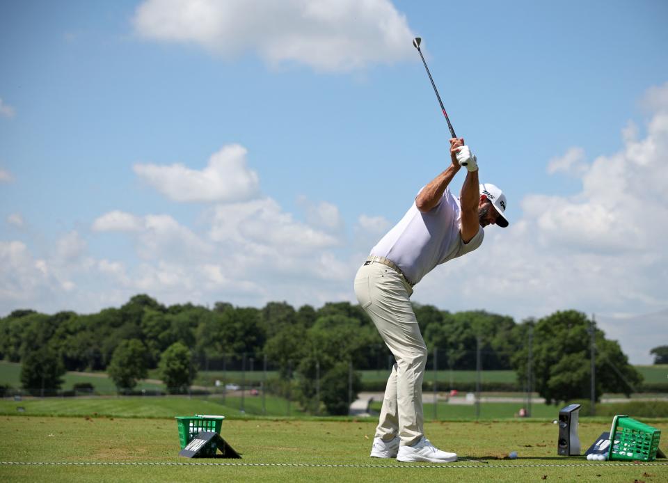 U.S. Golfer Dustin Johnson practices on the driving range ahead of ahead of the forthcoming LIV Golf Invitational Series event at The Centurion Club in St Albans, north of London, on June 7, 2022. (Photo by ADRIAN DENNIS/AFP via Getty Images)