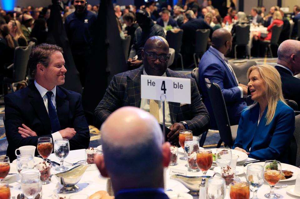 JAX Chamber President and CEO Daniel Davis, left, talks with Mayor Donna Deegan, right, while sitting with JAXUSA Partnership President Aundra Wallace during a JAXUSA Partnership luncheon March 28 when Deegan was the keynote speaker. Deegan defeated Davis in the 2023 election for mayor. They have sought to forge a working relationship between the mayor's office and the chamber.