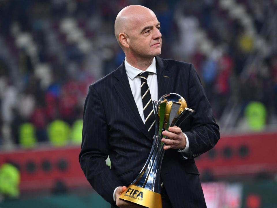 Fifa president Gianni Infantino with the Club World Cup trophy  (Getty)