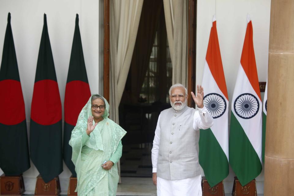 Indian Prime Minister Narendra Modi, right, and his Bangladeshi counterpart Sheikh Hasina wave to the waiting media before their delegation level talks in New Delhi, India, Tuesday, Sept. 6, 2022. The relationship between the neighbors is crucial, with India being Bangladesh’s largest trading partner in South Asia. While China is involved in almost all major infrastructure development schemes in Bangladesh, India is also more eager to take up joint projects. (AP Photo)