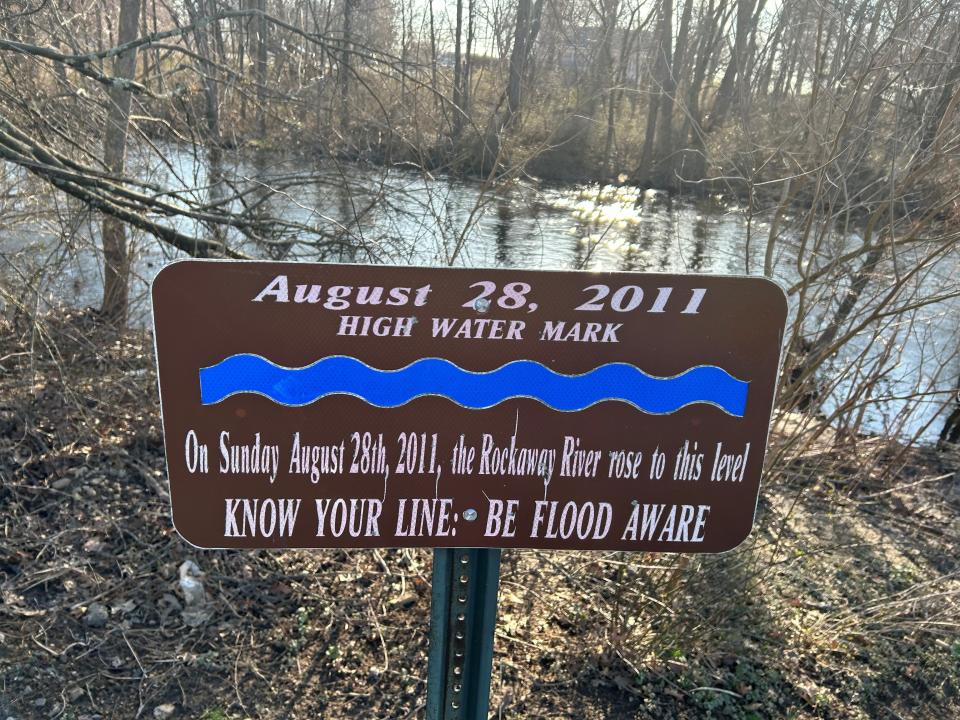 A sign at Park Meadow shows the level reached by the Rockaway River after Tropical Storm Irene flooded the region on 2011.