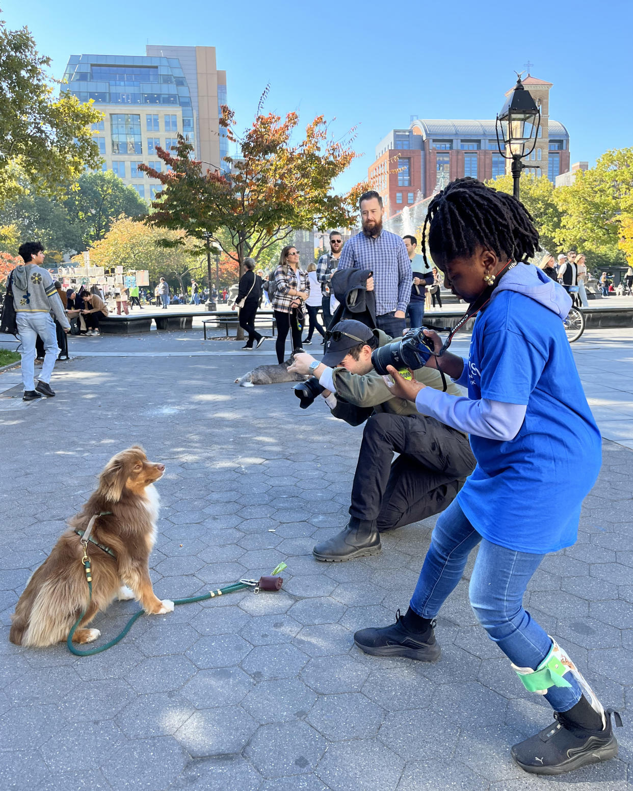 Elias Weiss Friedman, aka The Dogist, said Zoey Henry is a natural when it comes to photographing dogs. Here they are with Roo. (Courtesy Make-A-Wish)