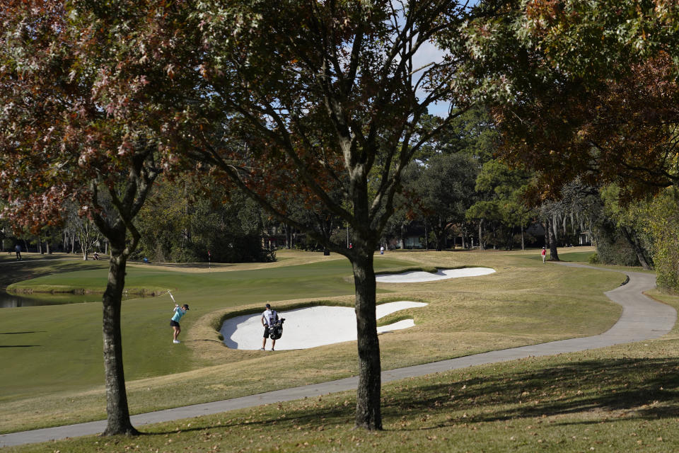 Austin Ernst hits from the 12th fairway, during the first round of the U.S. Women's Open Golf tournament, Thursday, Dec. 10, 2020, in Houston. (AP Photo/David J. Phillip)
