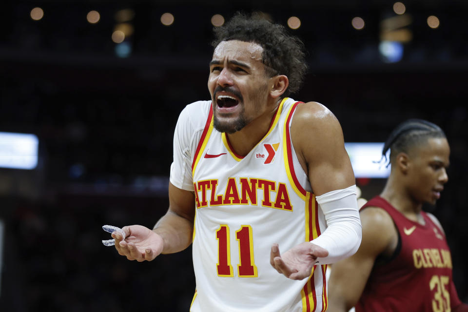 Atlanta Hawks guard Trae Young reacts after a foul call during the second half of an NBA basketball game against the Cleveland Cavaliers, Saturday, Dec. 16, 2023, in Cleveland. (AP Photo/Ron Schwane)