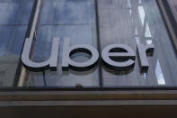 FILE - An Uber sign is displayed at the company's headquarters in San Francisco, Monday, Sept. 12, 2022. The future of Uber and Lyft in Minneapolis has been a source of concern and debate in recent weeks after the City Council voted last month to require that ride-hailing companies pay drivers a higher rate while they are within city limits. (AP Photo/Jeff Chiu, File)