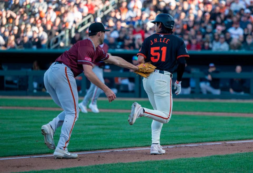 Sacramento River Cats’ Mason Black tags out San Francisco Giants’ Jung-Hoo Lee who got caught in a pickle during an exhibition game Sunday.