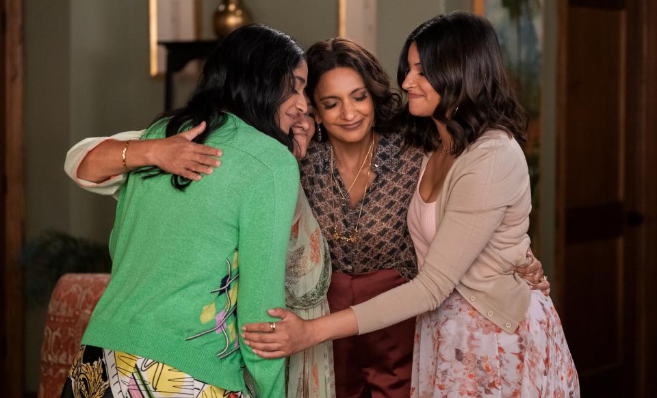 Four women of varying ages hug in their family living room; still from "Never Have I Ever"