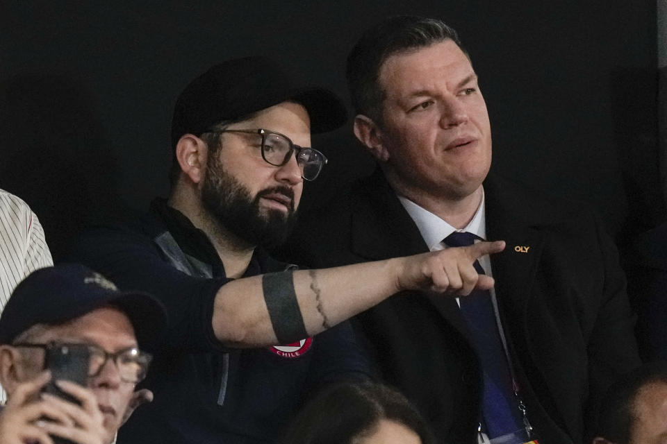 Chile's President Gabriel Boric watches judo final competitions at the Pan American Games in Santiago, Chile, Sunday, Oct. 29, 2023. (AP Photo/Eduardo Verdugo)