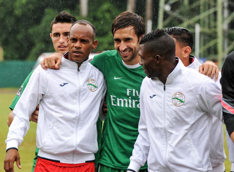 The New York Cosmos' Raul Gonzalez (C) poses for photos with Cuban players after their friendly match at Pedro Marrero stadium in Havana, on June 2, 2015