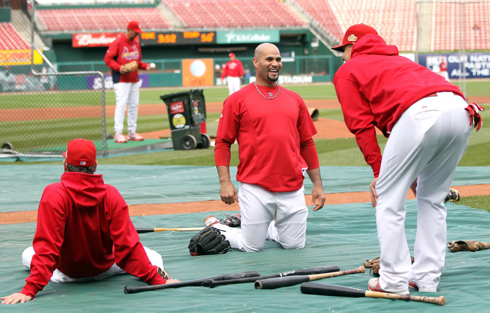 ST LOUIS, MO - OCTOBER 20: Albert Pujols #5 of the St. Louis Cardinals stretches on the field during batting practice prior to Game Two of the MLB World Series against the Texas Rangers at Busch Stadium on October 20, 2011 in St Louis, Missouri. (Photo by Jamie Squire/Getty Images)