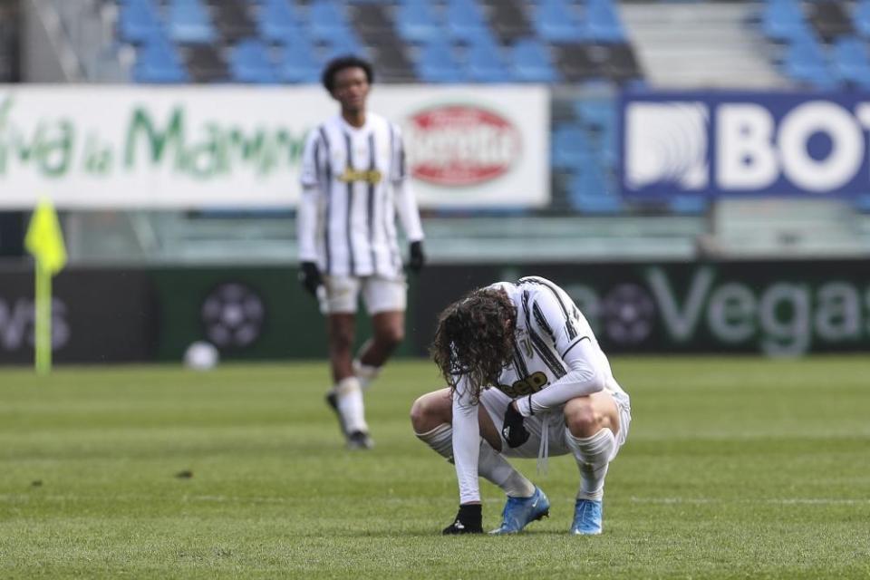 Juventus’s Adrien Rabiot squats on the pitch.