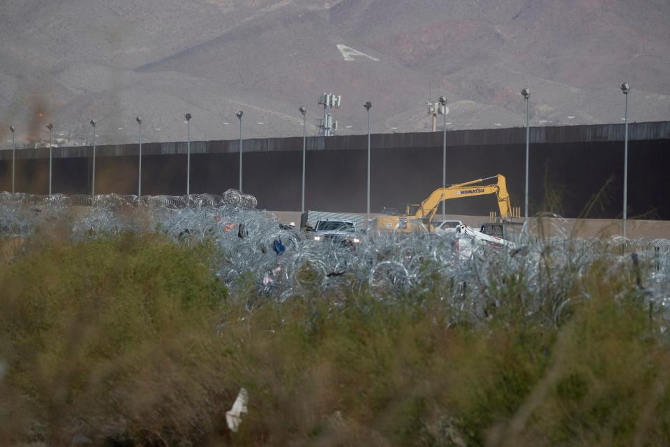 Concertina wire and heavy machinery is seen on the Rio Grande in El Paso, Texas as the Texas National Guard continues to erect structures on the international border with Mexico in an attempt to stop asylum seekers from entering the U.S. on March 6.