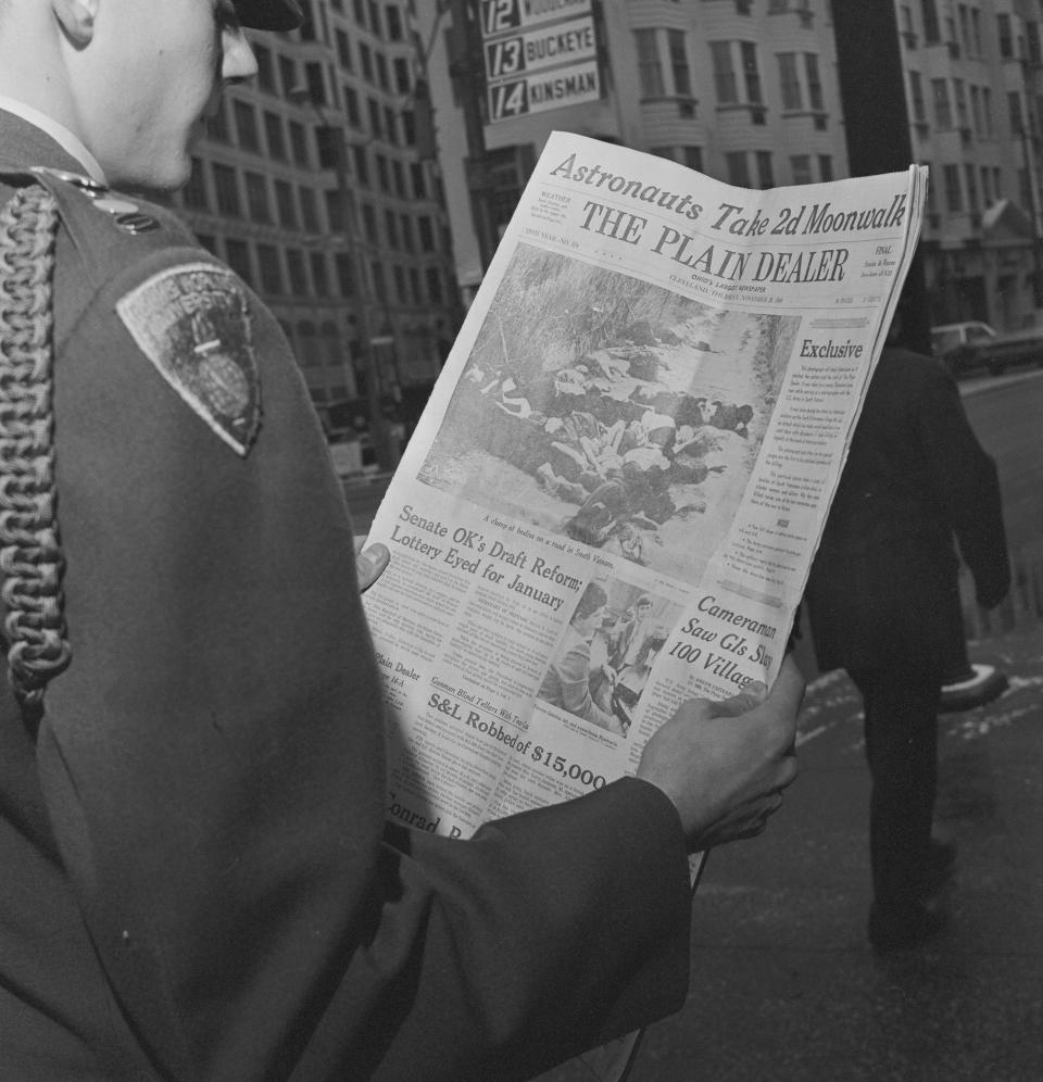 An officer training candidate looks at pictures made by Ronald L. Haeberle, a former Army photographer, that appeared in the appeared in Nov. 20, 1969, issue of the <em>Plain Dealer</em> in Cleveland.
