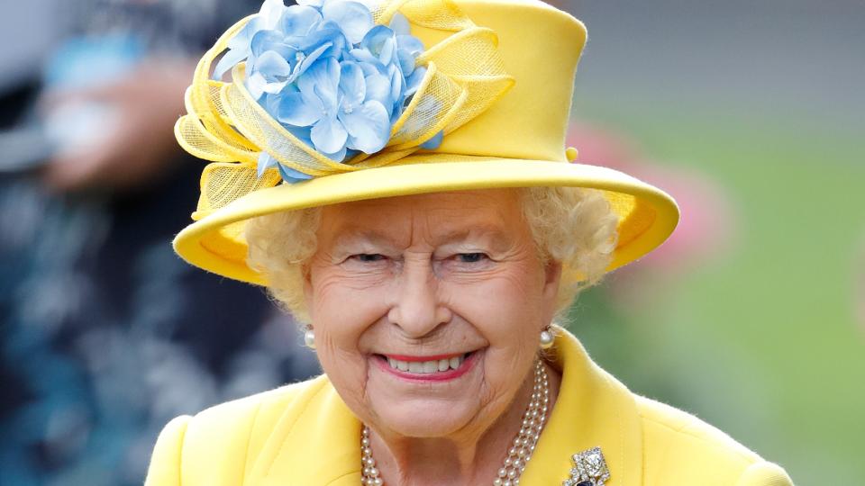 Queen Elizabeth watches her horse 'Fabricate' run in the Wolferton Stakes on day 1 of Royal Ascot