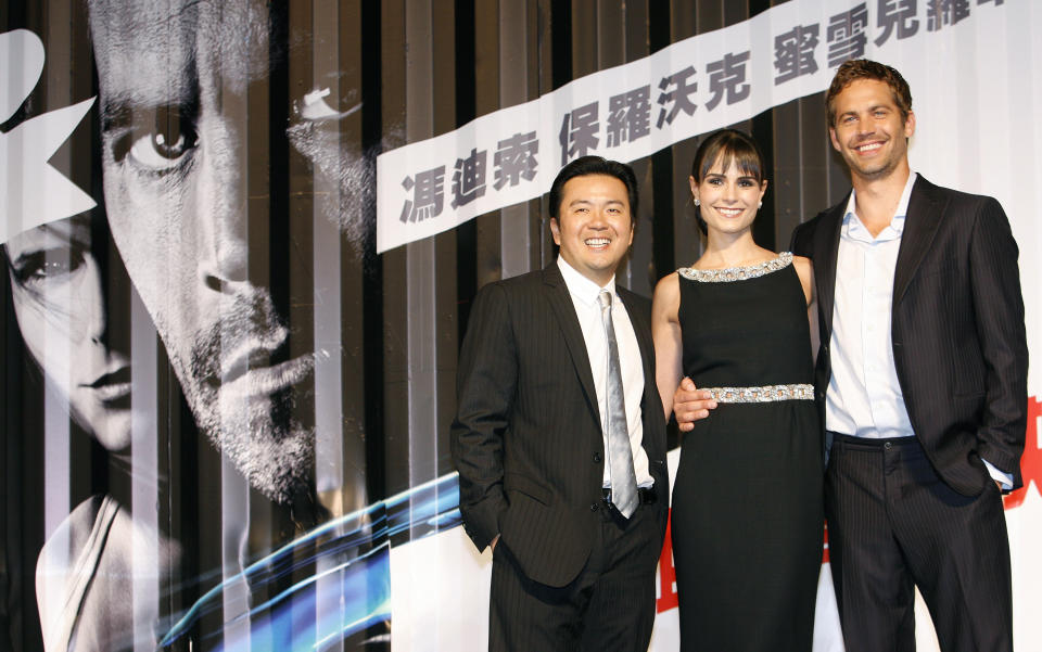 Taiwan-born director Justin Lin (L), Panama-born actress Jordana Brewster (C) and U.S. actor Paul Walker pose for photographers during the premiere of the movie 