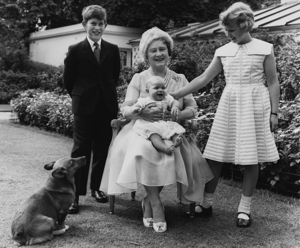 Queen Elizabeth the Queen Mother in the garden of Clarence House on the occasion of her 60th birthday, with her grandchildren Prince Charles, Princess Anne, and Prince Andrew, who is almost 6 months old. (Photo by © Hulton-Deutsch Collection/CORBIS/Corbis via Getty Images)