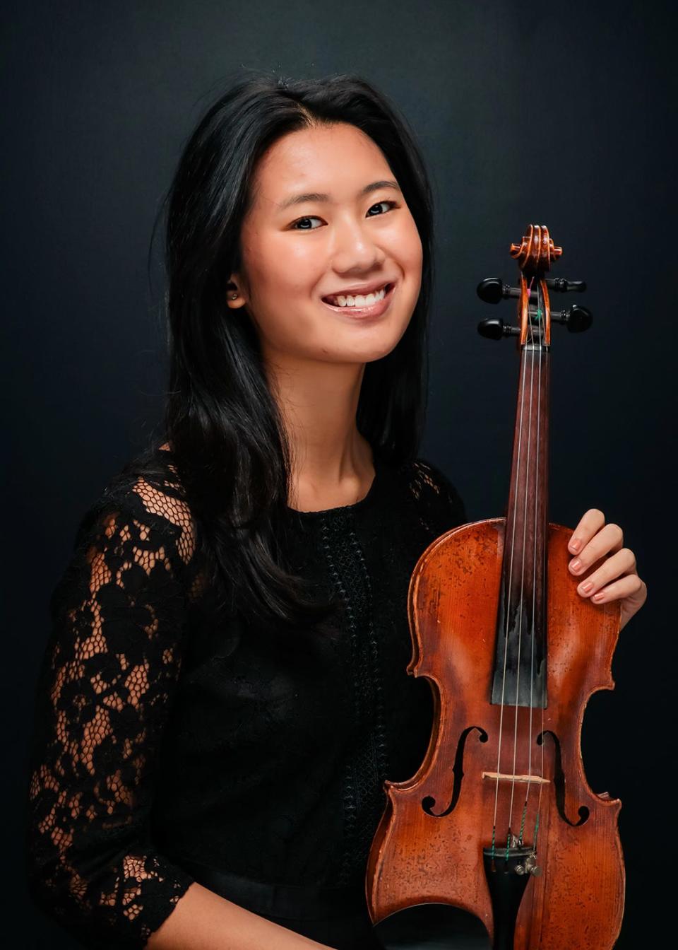 Danae Tran, a Booker High School graduate, will major in violin performance. Tran hopes to become a member of a prestigious orchestra.