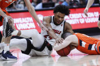 Louisville forward Dwayne Sutton (24) battles for the ball with Syracuse guard Joseph Girard III (11) during the first half of an NCAA college basketball game Wednesday, Feb. 19, 2020, in Louisville, Ky. (AP Photo/Wade Payne)