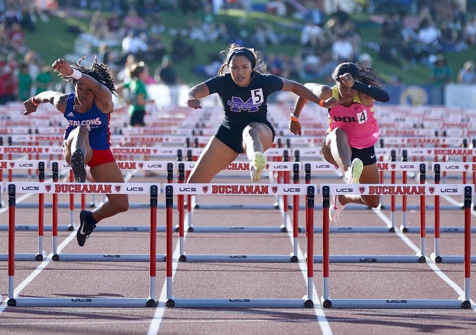 Marlborough senior Fallyn Gowans, cengter, leads the field i winning her 100-meter hurdles heat in 14.25 seconds.