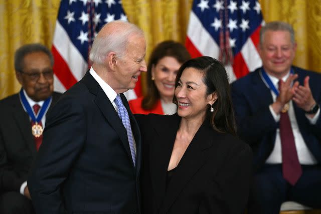 <p>ANDREW CABALLERO-REYNOLDS/AFP via Getty</p> President Joe Biden and Michelle Yeoh