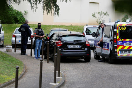 Investigators are seen during a police operation in Oullins, France, May 27, 2019. REUTERS/Emmanuel Foudrot