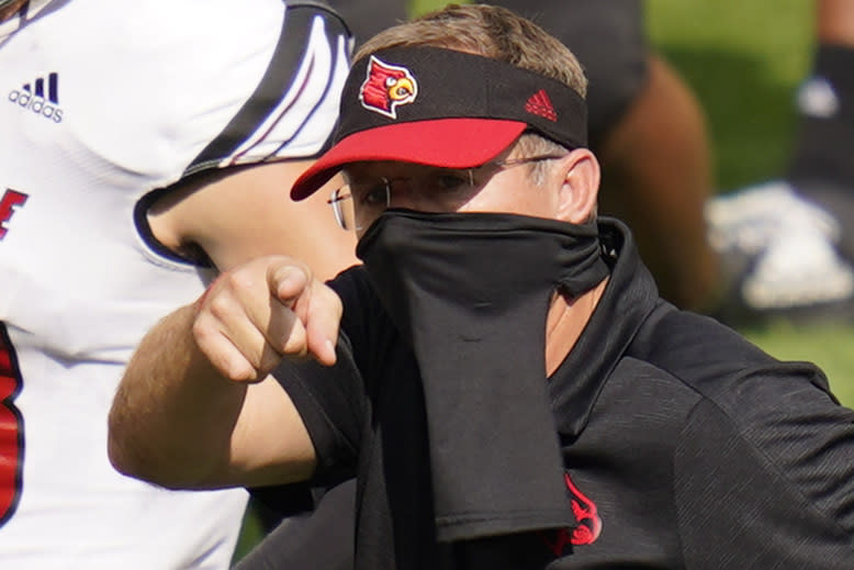 Louisville head coach Scott Satterfield points towards the Pittsburgh bench after an NCAA college football game, Saturday, Sept. 26, 2020, in Pittsburgh. (AP Photo/Keith Srakocic)