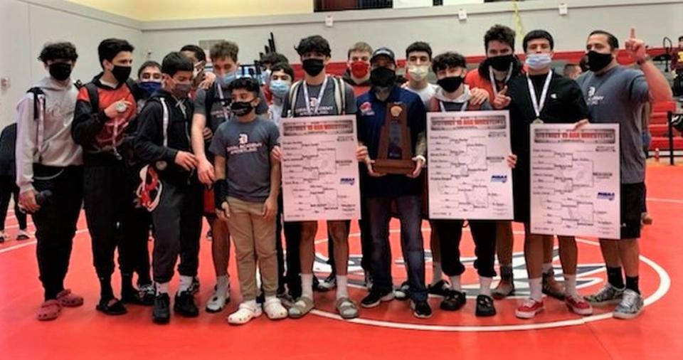 Doral Academy High School wrestling won a 3A district title.