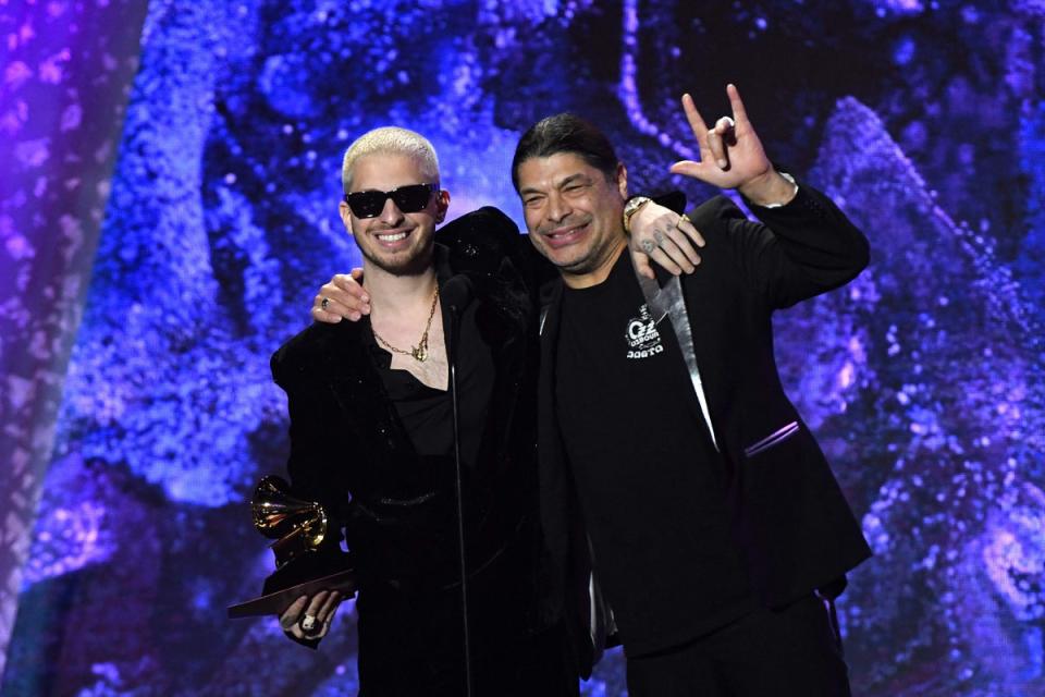 Ozzy Osbourne’s producer Andrew Watt and bass guitarist Robert Trujillo accepted the awards in his absence (AFP via Getty Images)