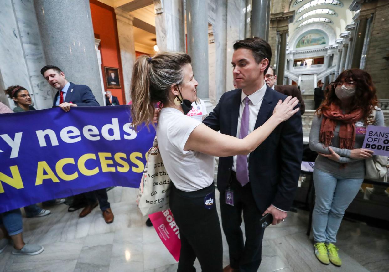 Sen. Morgan McGarvey hugs Lucy Blackburn, an abortion-rights supporter, during the waning days of legislative session at the state capitol in Frankfort. April 13, 2022