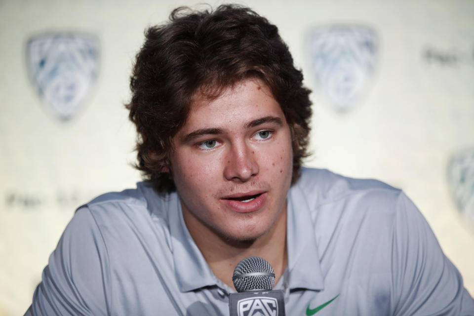 Oregon quarterback Justin Herbert speaks at the Pac-12 Conference NCAA college football Media Day in Los Angeles, Wednesday, July 25, 2018. (AP Photo/Jae C. Hong)