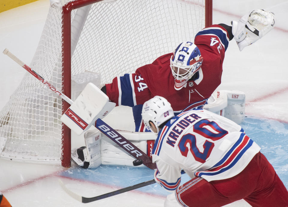 Montreal Canadiens goaltender Jake Allen makes a save against New York Rangers' Chris Kreider during the second period of an NHL hockey game Saturday, Oct. 16, 2021, in Montreal. (Graham Hughes/The Canadian Press via AP)