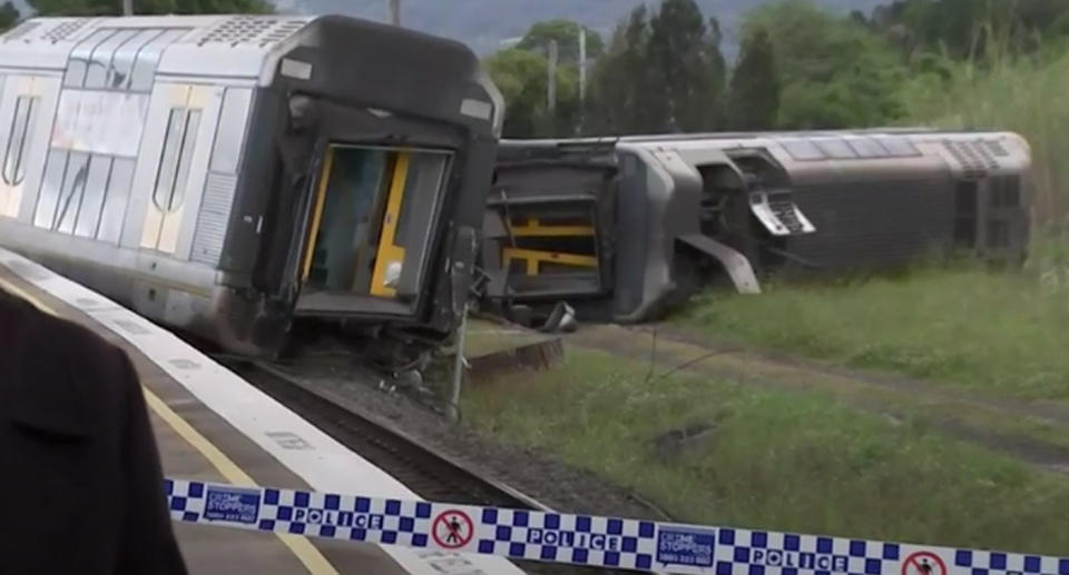 Police are investigating how the car came to be on the tracks. Source: ABC