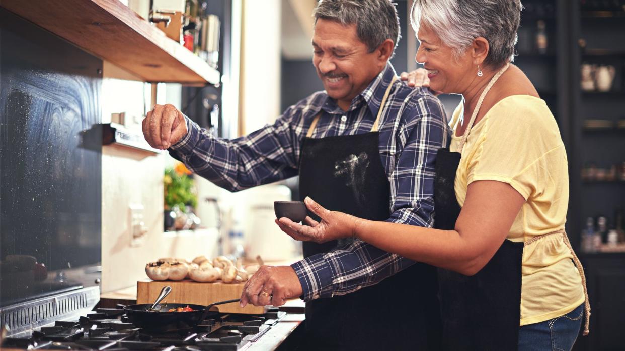 Shot of a happy senior couple cooking together at homehttp://195.