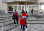 Female students of American University of Afghanistan hug each other as they arrive for new orientation sessions at a American University in Kabul, Afghanistan March 27, 2017.REUTERS/Mohammad Ismail