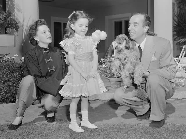 <p>Bettmann</p> Judy Garland with her husband, director Vincente Minnelli, and their daughter Liza Minnelli.