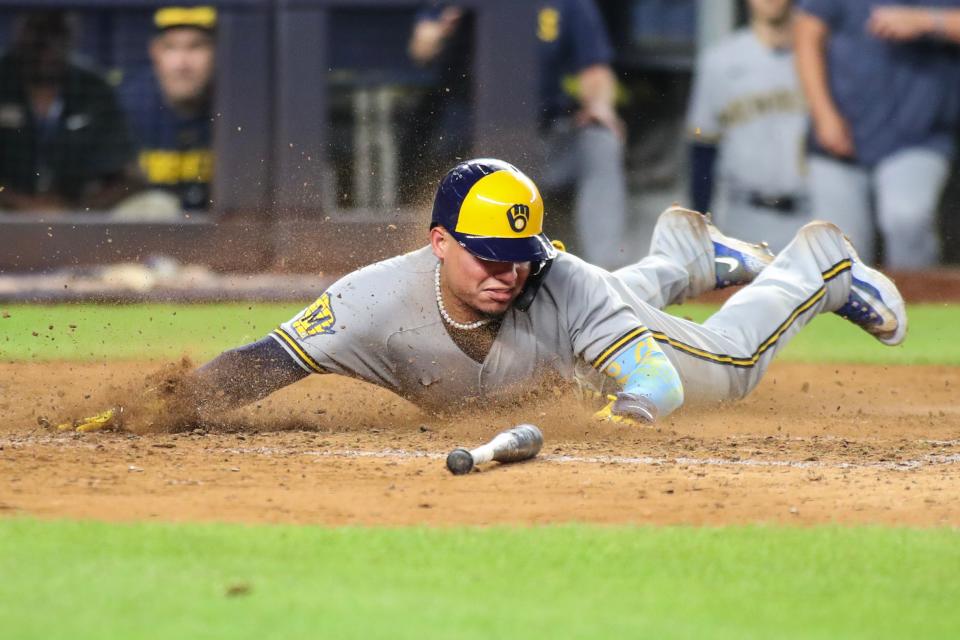 William Contreras slides safely across home plate during the Brewers three-run seventh inning against the Yankees on Saturday night at Yankee Stadium.