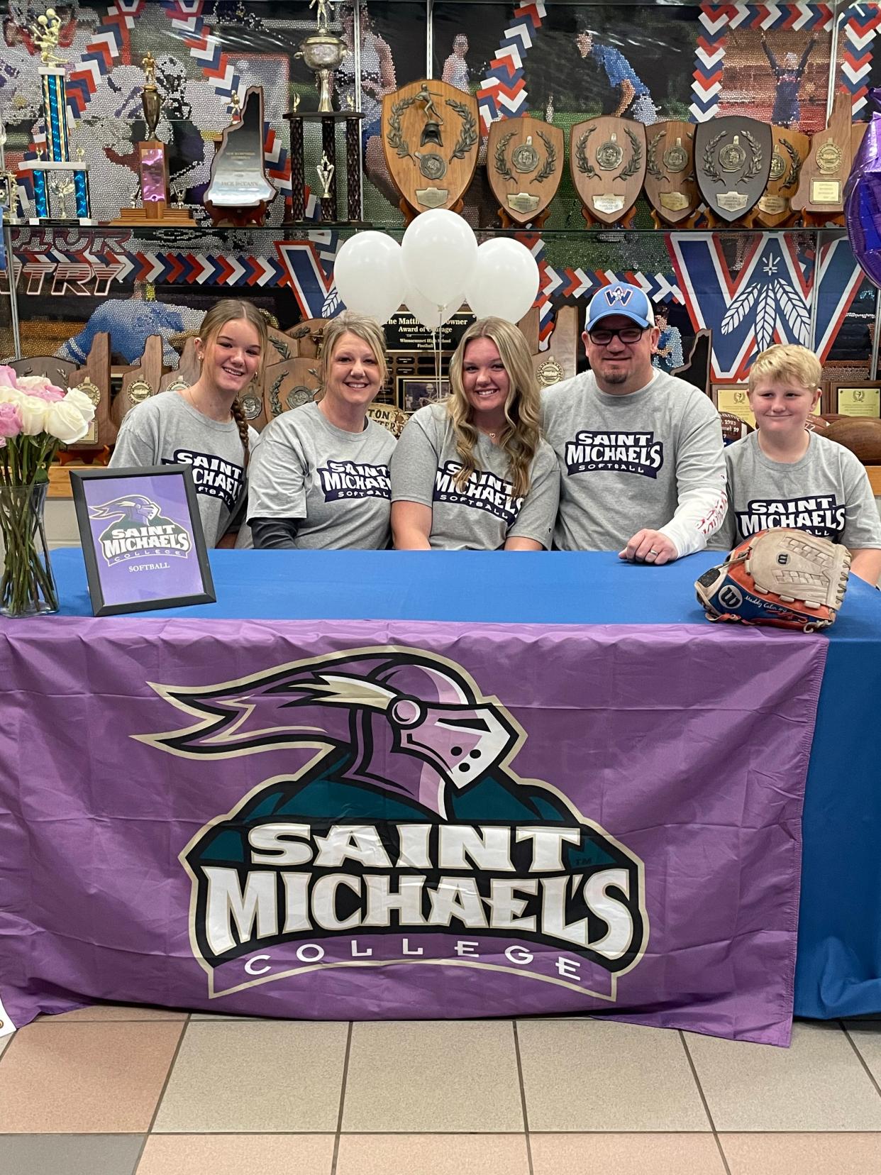 Winnacunnet's Maddie Eaton, center, recently announced her commitment to play softball at Division II Saint Michael's College. Eaton was joined at her signing by her parents Matt and Melanie; her sister, Marley; and her brother, Jackson.