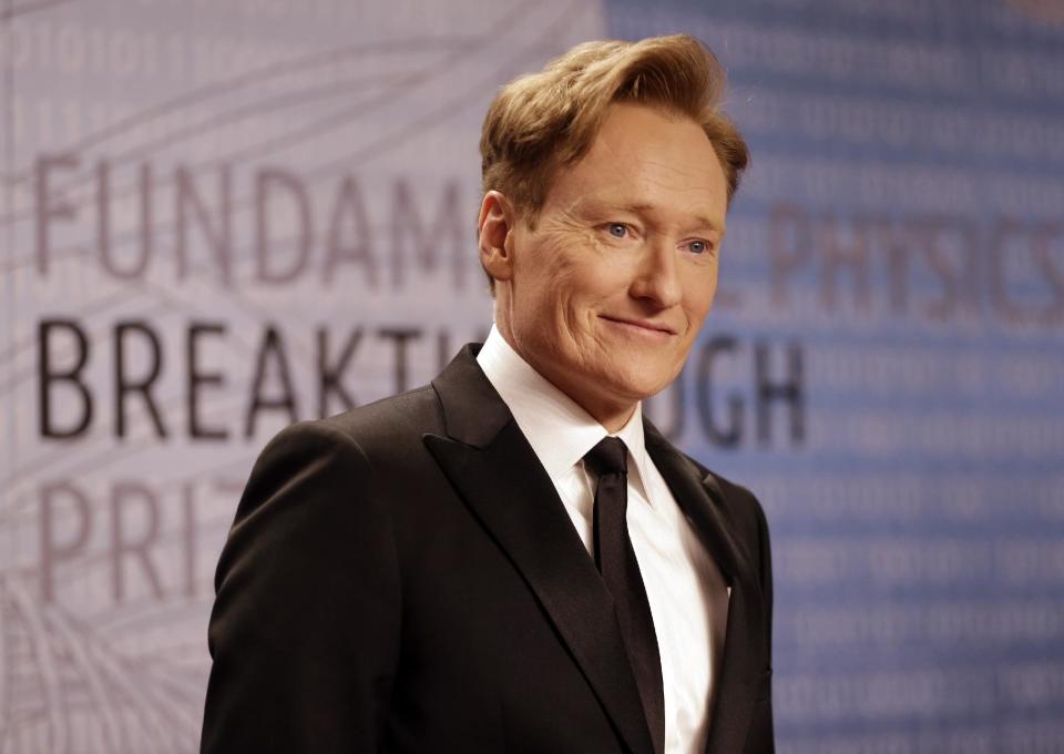 FILE - In this Dec. 12, 2013, file photo, talk show host Conan O'Brien arrives for the Breakthrough Prize in Life Sciences awards in Moffett Field, Calif. O'Brien hosts the 2014 MTV Movie Awards on Sunday, April 13, 2014, at the Nokia Theatre in downtown Los Angeles. (AP Photo/Ben Margot, file)